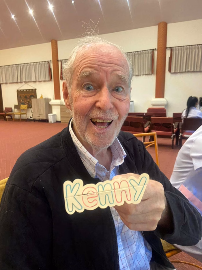A resident giving a thumbs up.