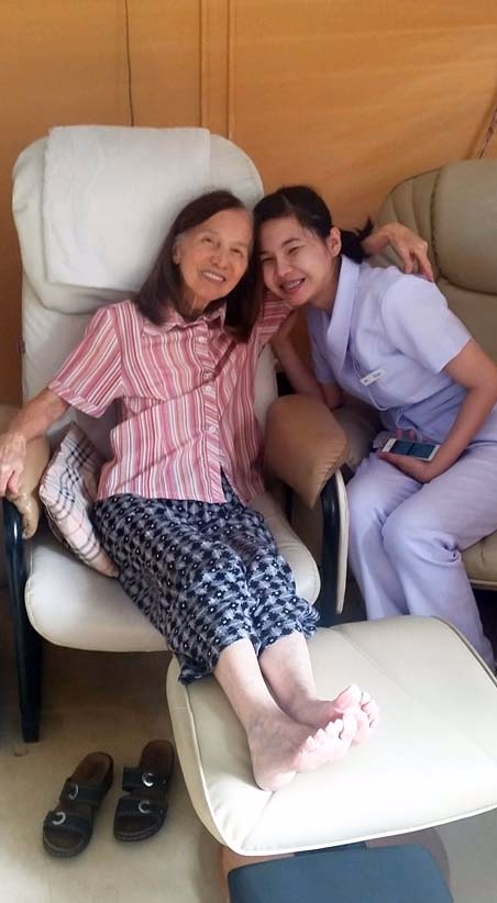 A carer giving a resident a foot spa.