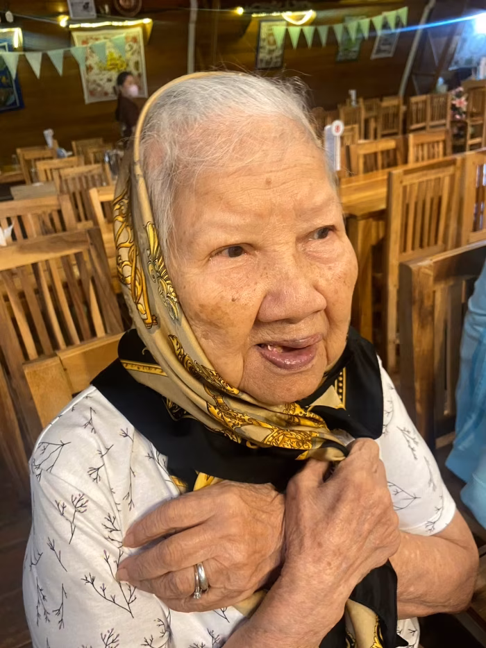 A resident in a headscarf, portrait.