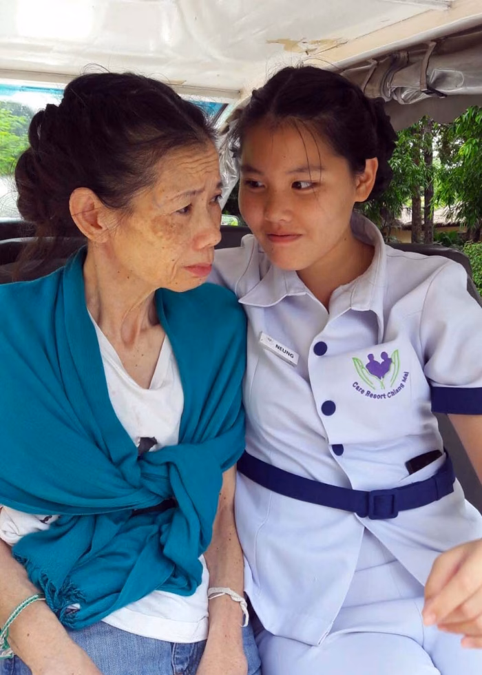 Two members of staff sharing a moment together.