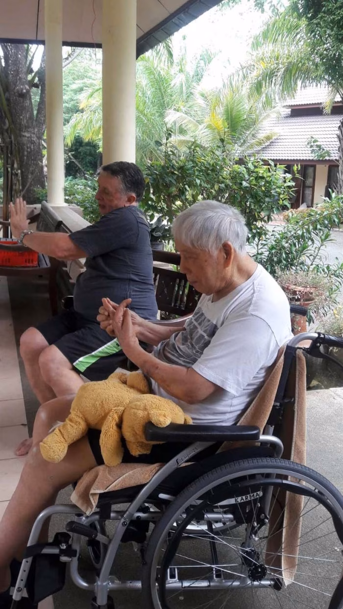 A resident relaxing on the covered terrace.