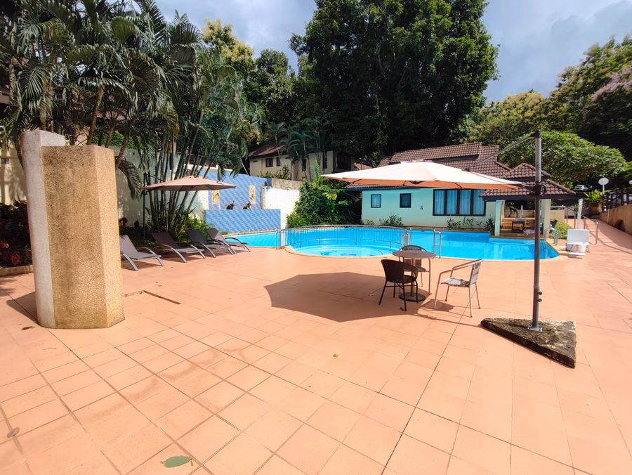 Pool 2, wide view with villas and mountains.