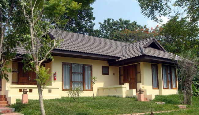 Exterior of a modern Thai-style villa in the resort gardens.